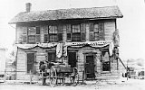 William Voegeli's bar on Monticello's Main St.  It sat on the lot where todays Post Office sits.  Photo is earlier that 1899.